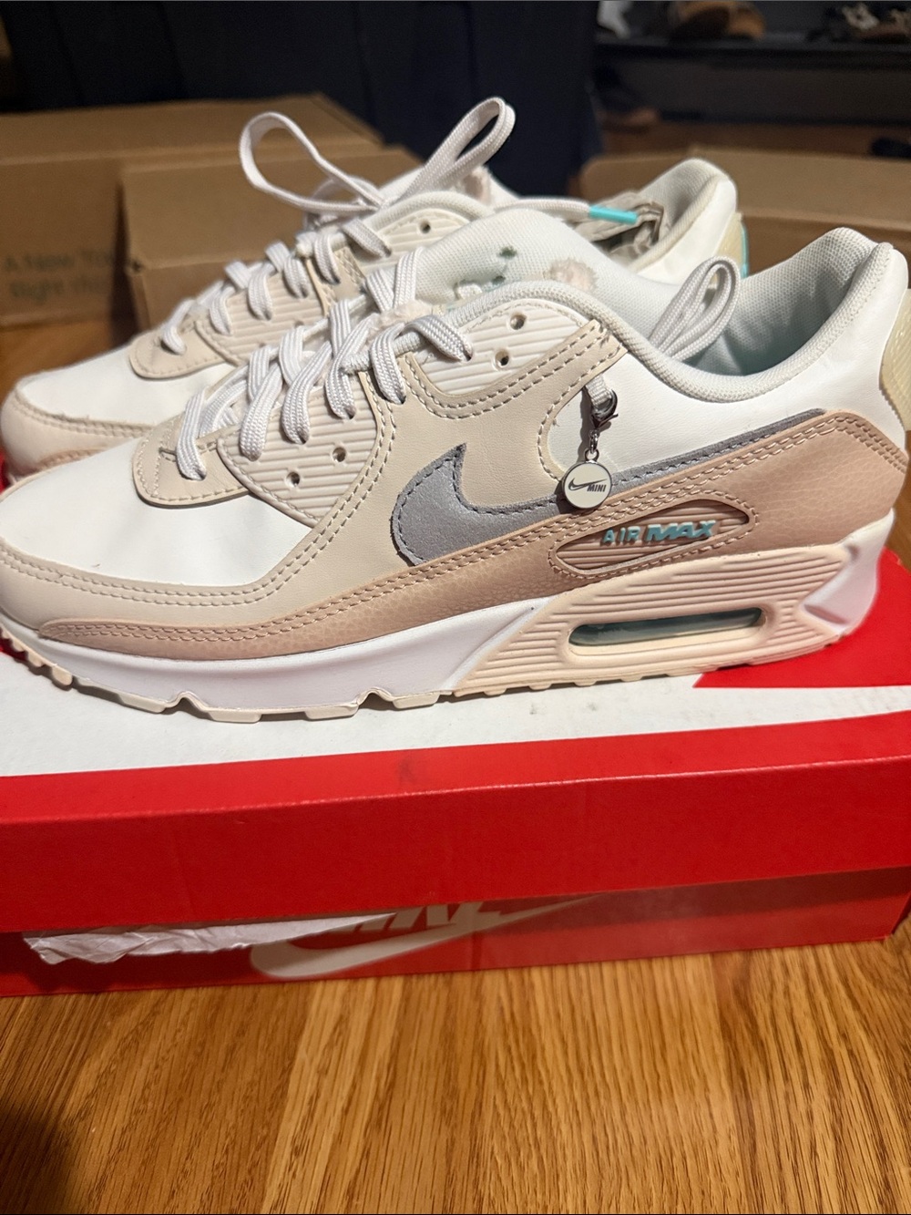 Woman’s Nike Air Max 90 Sneakers in White, Beige & Silver